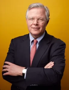 Cliff Hudson standing in front of yellow background